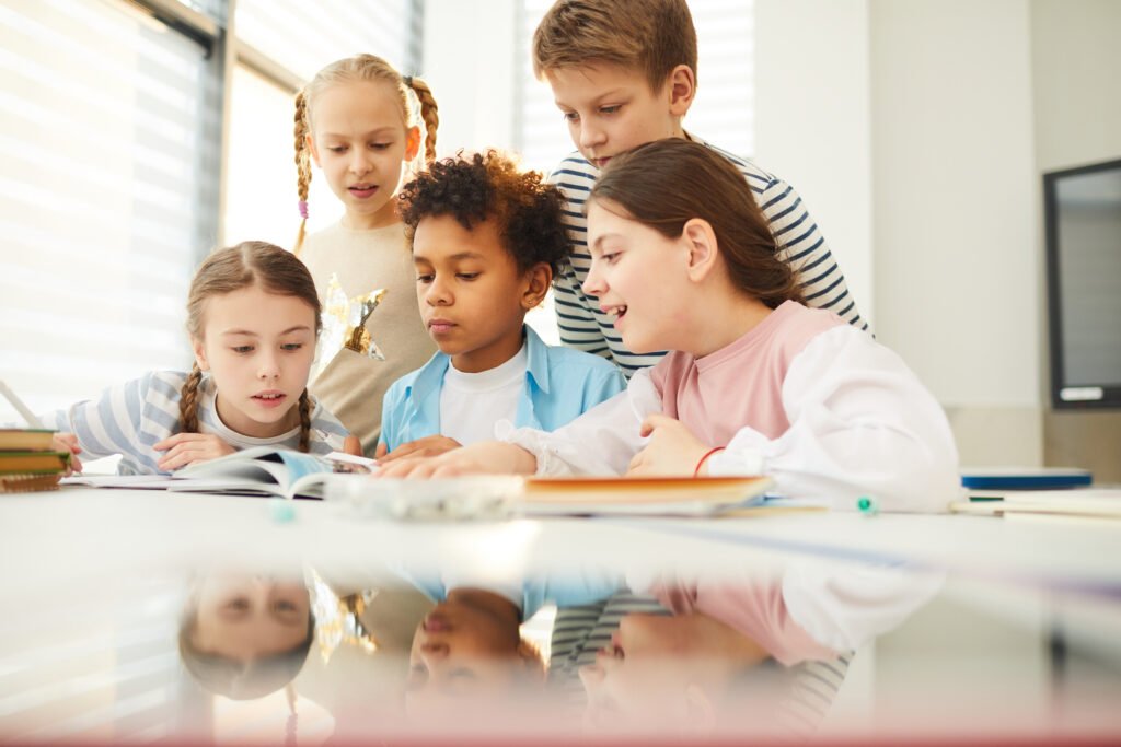 Understanding Neurodiversity – Embracing Different Ways of Learning children looking through book illustrations